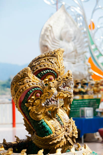 Thai Nakhon snakes at Mekong river on promenade of Golden Triangle in north Thailand