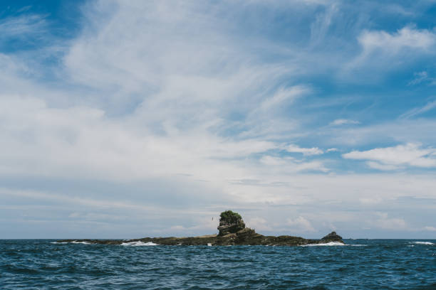 Looking at the sea and a little island from a boat