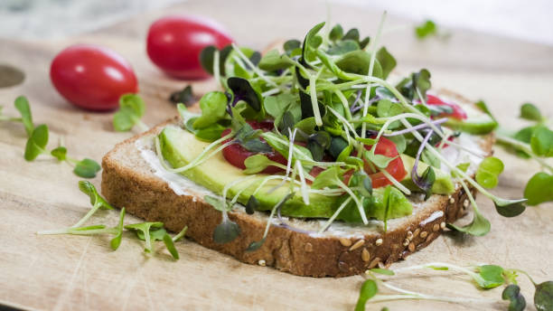 istock Avocado, tomato, mayonnaise and microgreen open-faced sandwich on whole wheat bread 2163281704