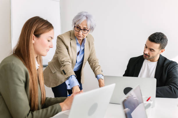istock Business people working together using laptop in the office 2163282157