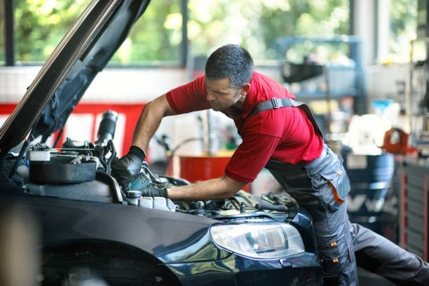 istock Car mechanic working the engine bay 2163286509