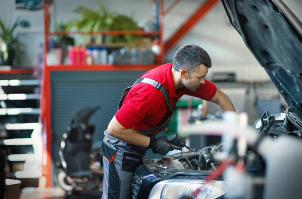 istock Car mechanic working the engine bay 2163286550