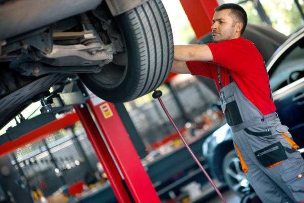 istock Car mechanic replacing a tire, 2163286621