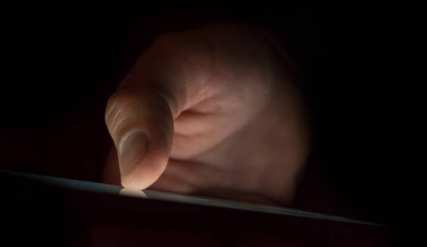 istock Bright touchscreen in the dark. Soft focus with shallow depth of field. 2163289463