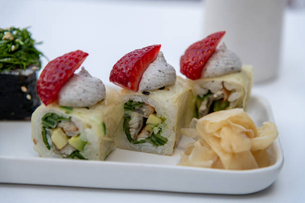 istock Sushi rolls with eel meat and strawberry 2163290650