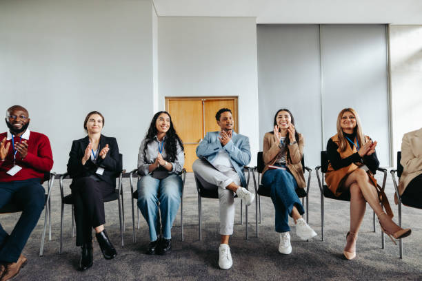 istock Shared enthusiasm: Diverse professionals applauding at a corporate workshop. 2163291779
