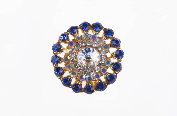 vintage brooch with blue stones isolated on white background
