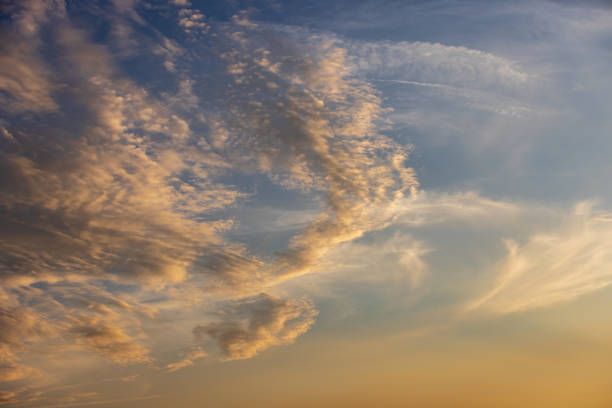istock A full frame photograph of a sunset sky with fluffy clouds 2163297914