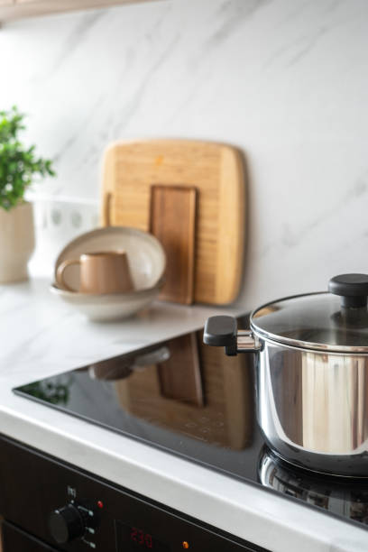 istock Stainless steel pot on induction stove in modern kitchen 2163300168