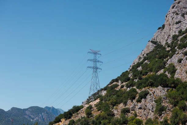 istock high voltage transmission line in mountains 2163302688