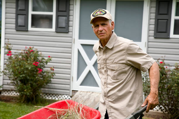 istock Desert Storm veteran pushing wheelbarrow in backyard 2163304187