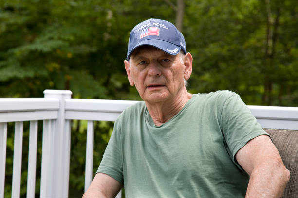 istock Senior U.S. veteran outdoors looking at camera 2163304829