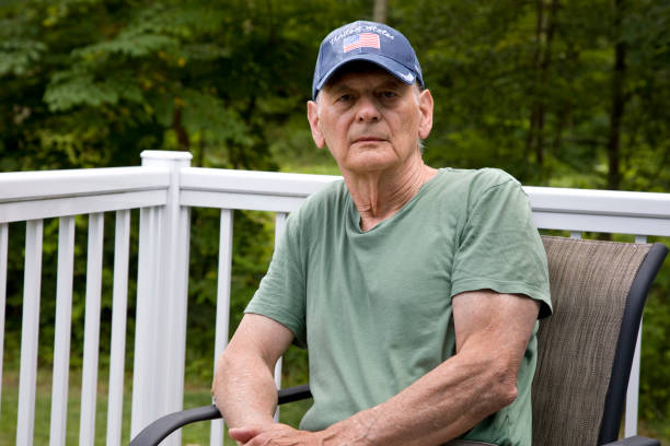 Senior U.S. veteran sitting looking at camera