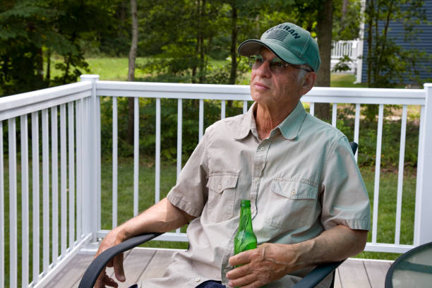 istock U.S. veteran relaxing at home with a beer 2163304839
