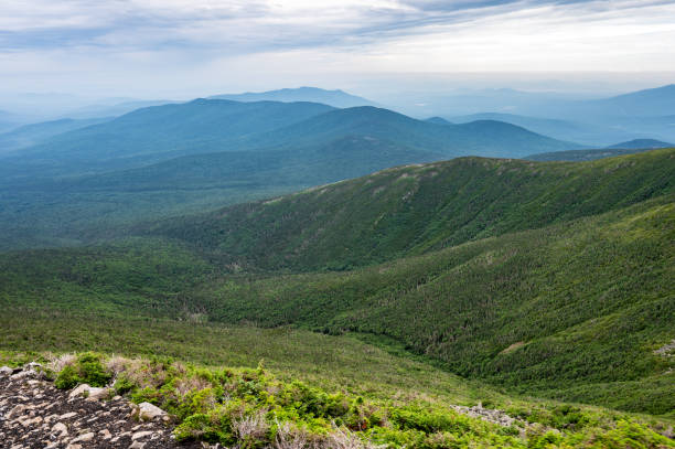 Mount Washington surroundings mountains seen from top of mountain during summer day