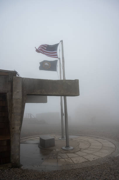 Fog at the top of Mount Washington with view on usa flag