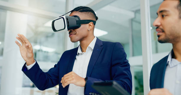 istock Businessman, vr and glasses in office together for product prototyping, training and experience with vision. Man, team and corporate professionals with virtual reality for metaverse and ux study 2163320602