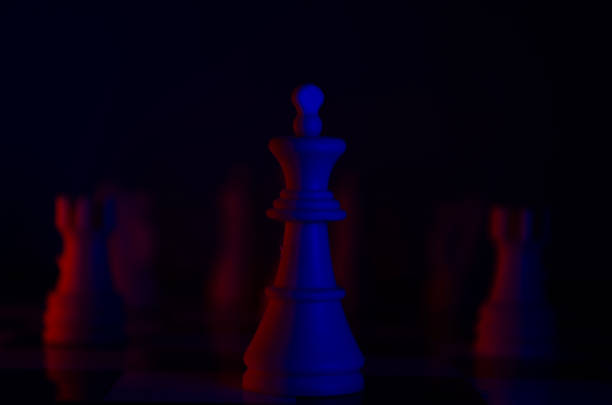 istock Chess Pieces on a Board with Red and Blue Lighting 2163321833