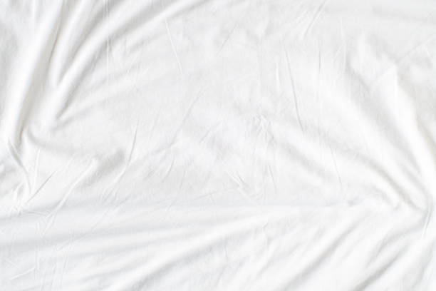 istock Abstract White Bedding Sheets or White wrinkled fabric background texture and Texture with copy-space :Creased or wrinkled white fabric,Soft focus 2163327681