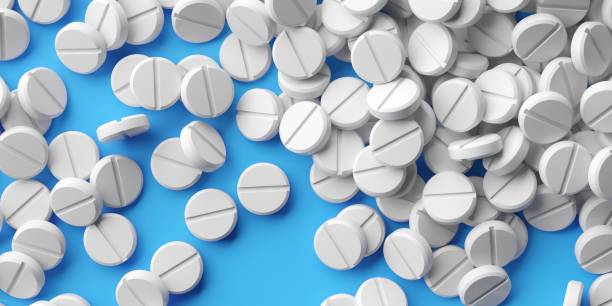 istock Abstract bunch of medicine pills on a white background 2163328434