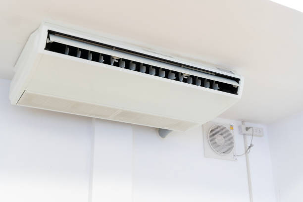 istock White air conditioner mounted on the wall inside the house. 2163329696