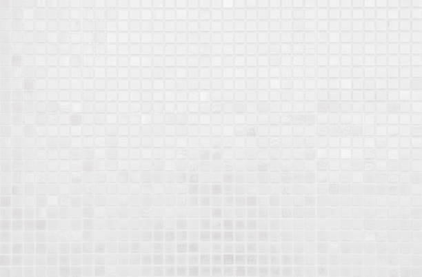 istock White tile wall chequered background bathroom texture. Ceramic brick wall and floor tiles mosaic background in bathroom and kitchen clean. Design pattern geometric with grid wallpaper decoration. 2163331142