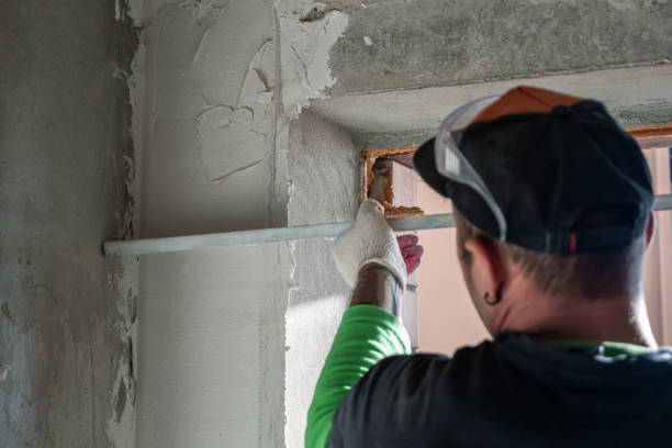 istock A plastered wall is being leveled with an aluminum rule 2163331324