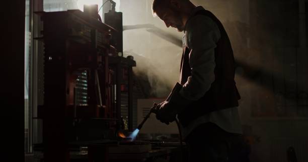 istock A Jeweler Crafts a Gold Ring Using a Gas Torch in an Old Workshop 2163332383