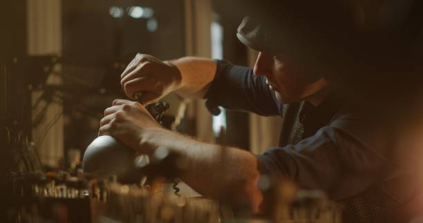 istock Jeweler Working on Attaching a Ring in Warmly Lit Workshop 2163334795