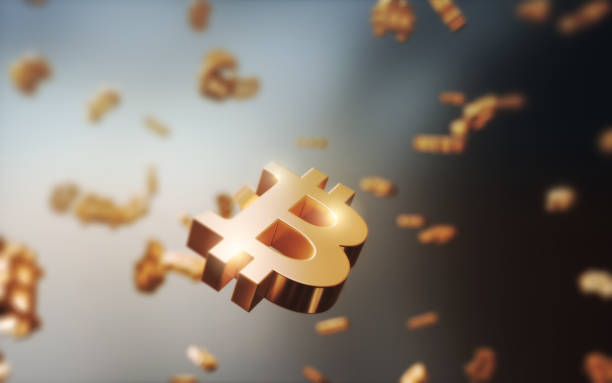 istock Yellow Metallic Bitcoin Icons Flying on Gradient Background 2163335347