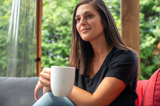 istock Young woman having a coffee 2163337695