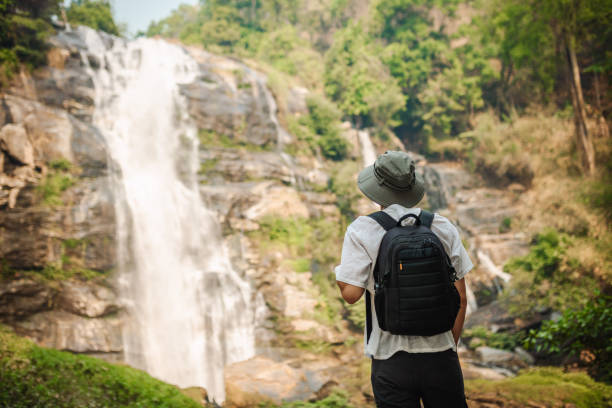 istock Young man exploring the tropical jungle 2163340170