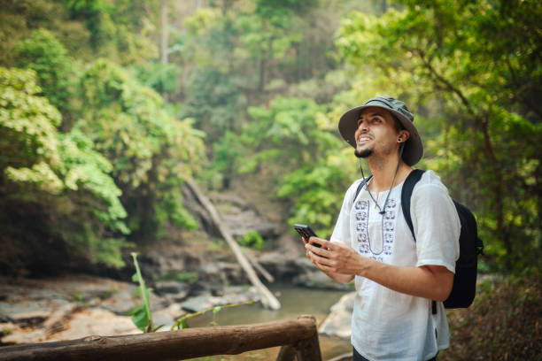 istock Young man exploring the tropical jungle 2163340172