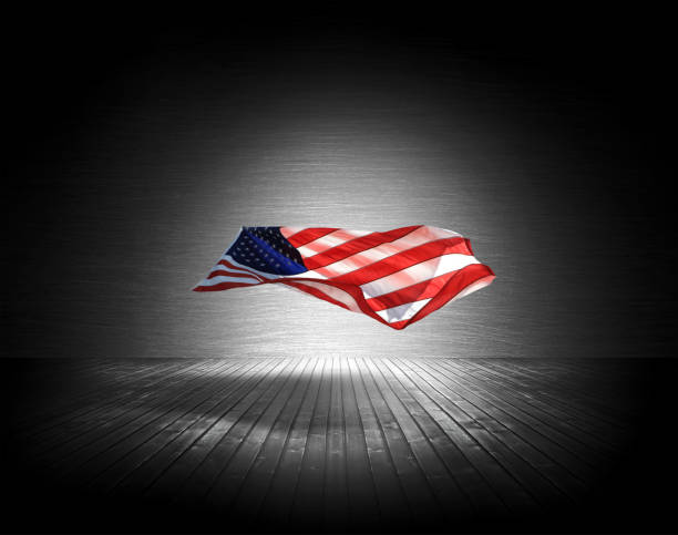 istock Single American flag floating in air under spotlight 2163346625