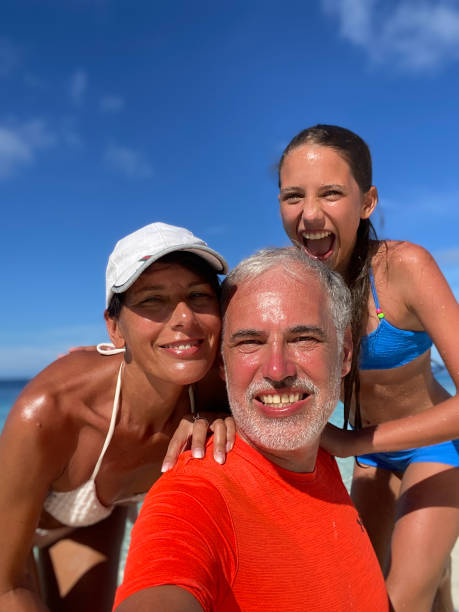 istock Family tropical beach vacation selfie 2163348760