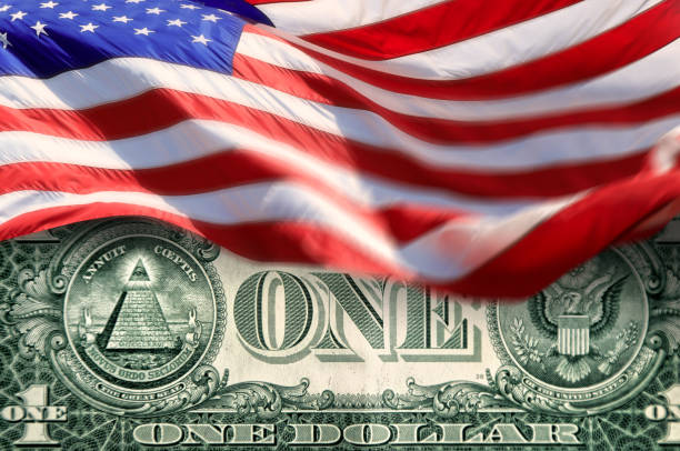 istock Conceptual American flags and one American dollar bill 2163349419