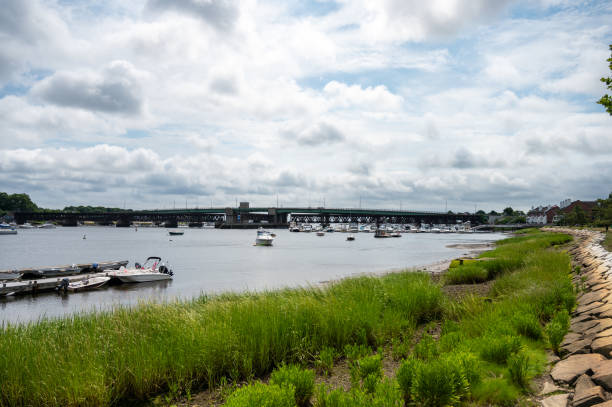 Boats on the Merrimack river in Newburyport, Massachusetts, during summer day.