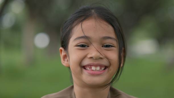 istock A young girl with a smile on her face 2163357108