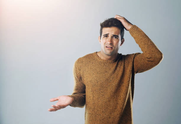 istock Man, confused and scratch head in studio portrait with decision, lost and mistake by background. Person, doubt and choice with mockup space for crisis, stress and error with wondering for solution 2163358402
