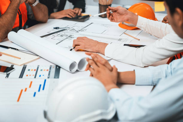 istock Diverse group of civil engineer and client working on architect. Prudent 2163360153