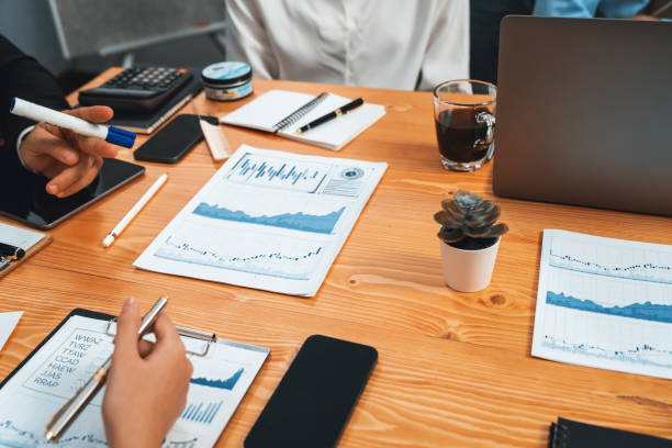 istock Group of business analyst team analyzing financial data report. Habiliment 2163360694