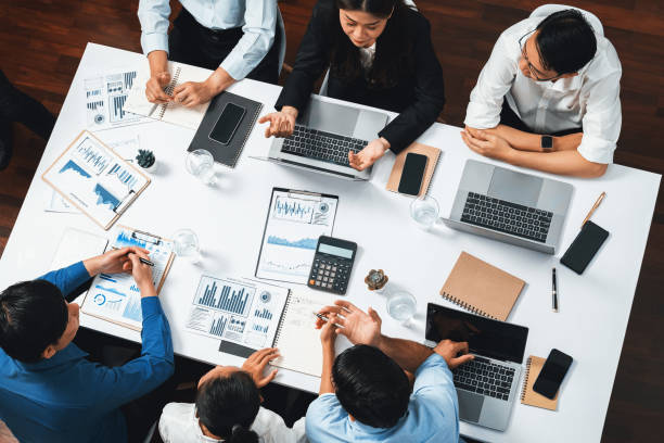 istock Analyst team utilizing BI Fintech to analyze financial data at table. Prudent 2163361028
