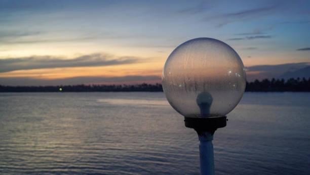 lamp overlooking the sea at sunset