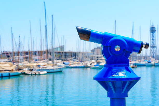Barcelona, Spain - July 16, 2024: Close-up of a bright blue viewfinder located along the marina, selective focus.
