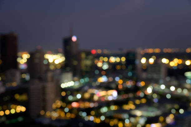 istock Blurred bokeh lights city office building, abstract background 2163363890