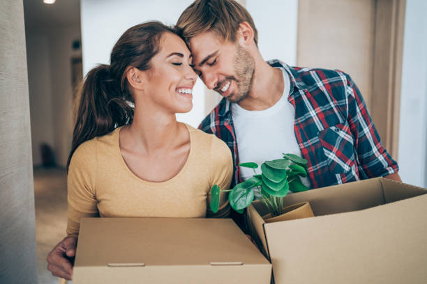 istock Young couple moving in new home. 2163365317