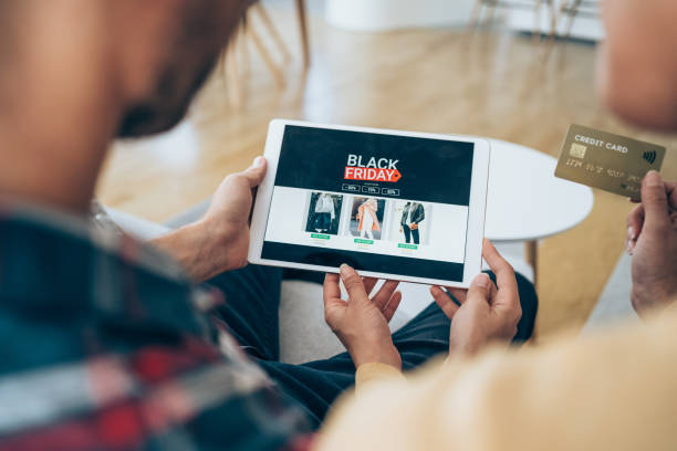 istock Couple shopping online on Black Friday. 2163365326