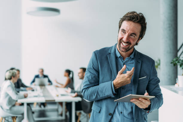 istock Confident businessman and his team. 2163365414