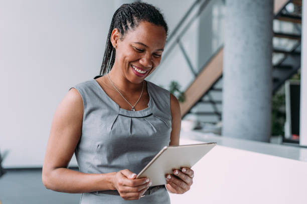 istock Confident businesswoman in modern office. 2163365415