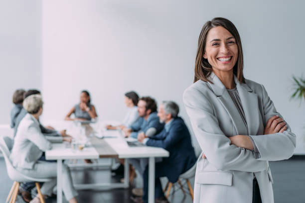 istock Confident businesswoman and her team. 2163365426